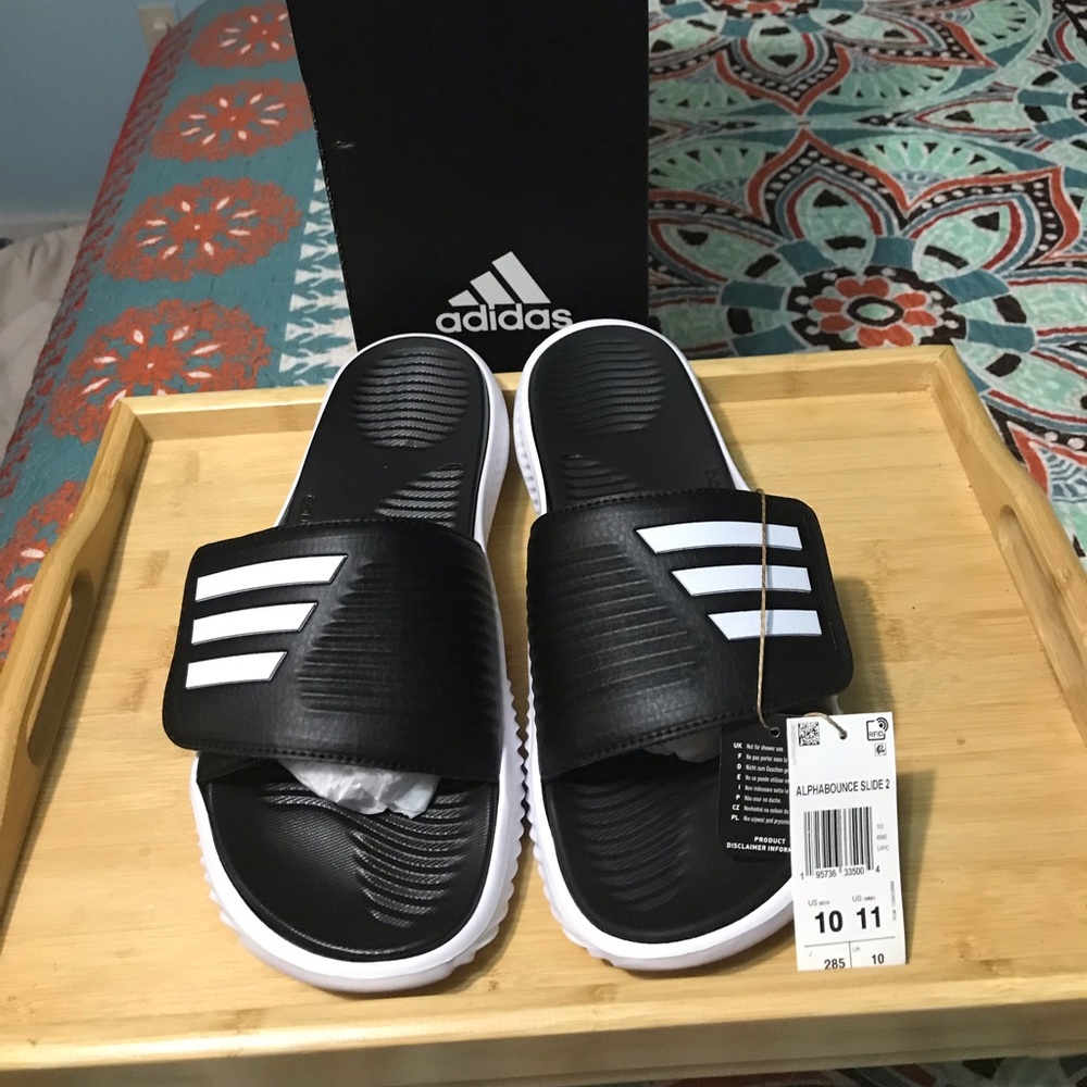 Brand new in the box Adidas slip on shoes mens size 10.5 women's size 12.